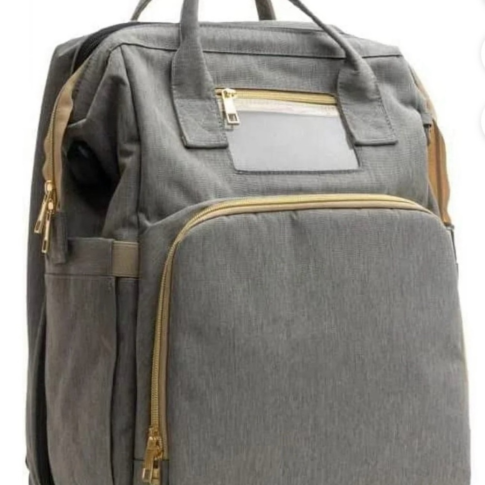 Diaper bag backpack with changing station built in